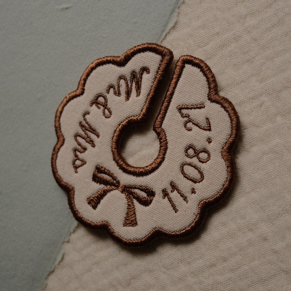 Neutral beige personalised wine charm with embroidered bow and custom text