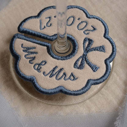 Dusty blue custom embroidered wine glass tag with initials and wedding date