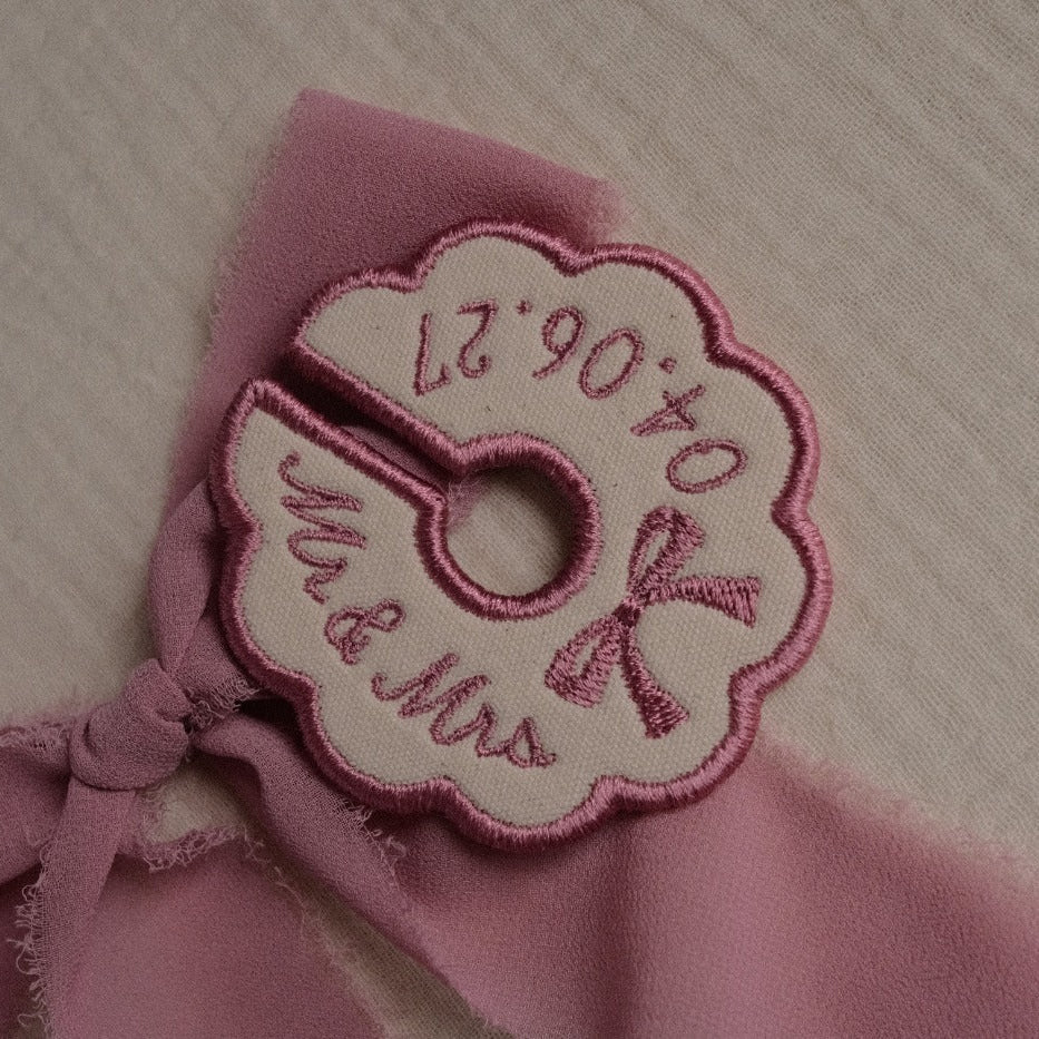 Pink embroidered wine stem tag with bow detail for bridesmaid wedding place setting