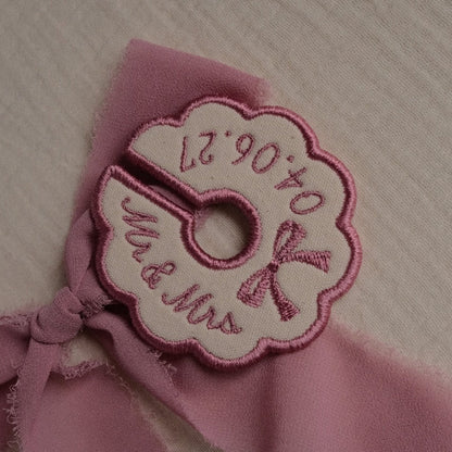 Pink embroidered wine stem tag with bow detail for bridesmaid wedding place setting