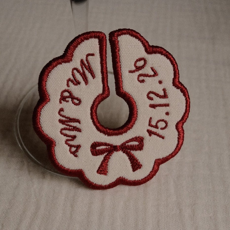 Burgundy embroidered wedding wine charm with custom names and date