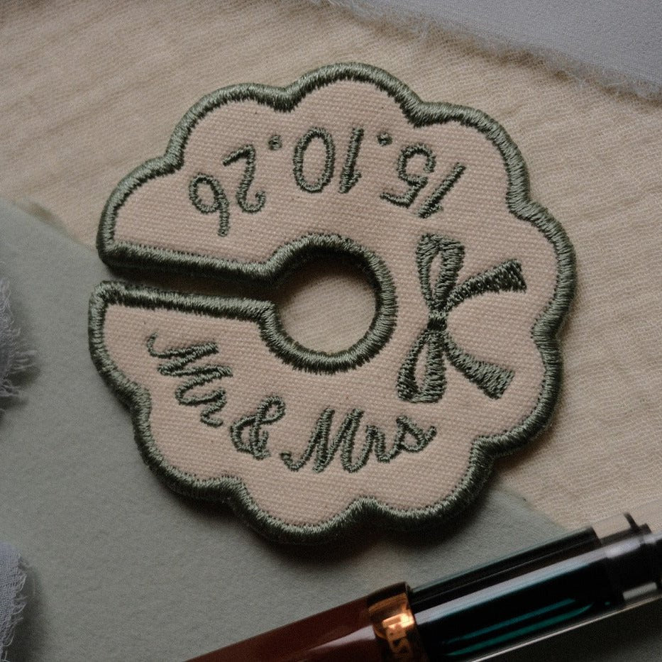 Sage green custom embroidered wine stem tag for wedding table settings