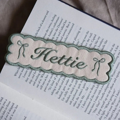 Custom embroidered name bookmark in sage.